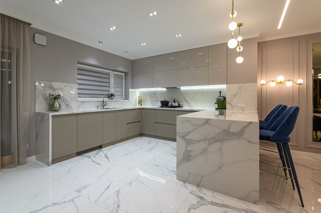 Luxury large modern white marble kitchen united with dining room and living room